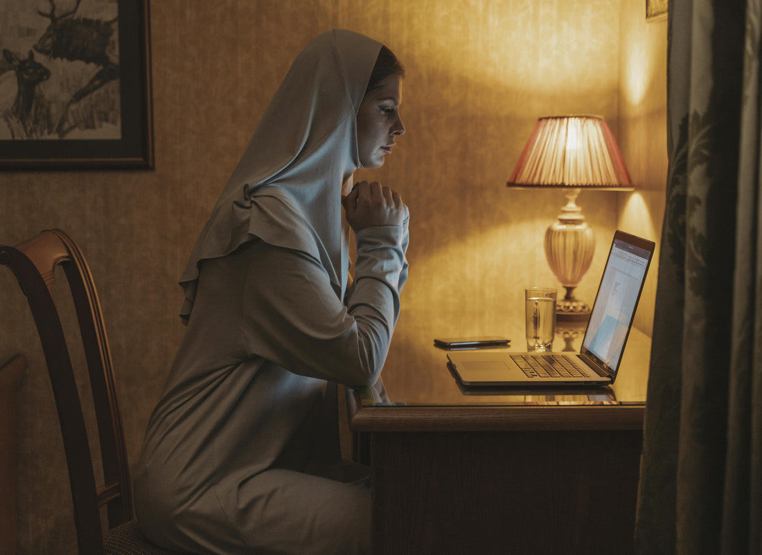 Nun working from homw, Woman working from home, Woman having online church service, Online Church Service